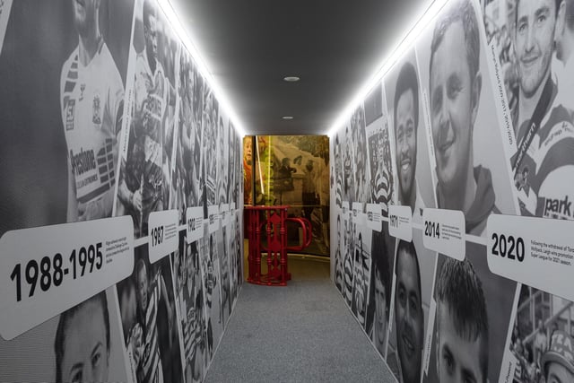 The exhibition begins with a tunnel full of famous faces throughout history