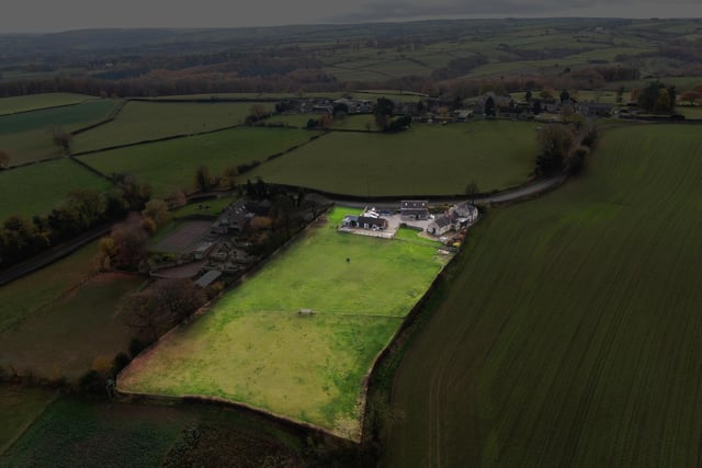 An aerial view of this property that comes with added barn accommodation, and is situated on the edge of the wonderful Peak District.