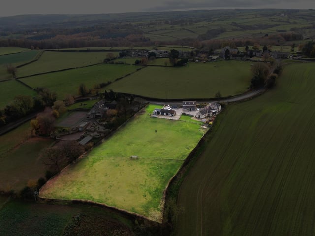 An aerial view of this property that comes with added barn accommodation, and is situated on the edge of the wonderful Peak District.