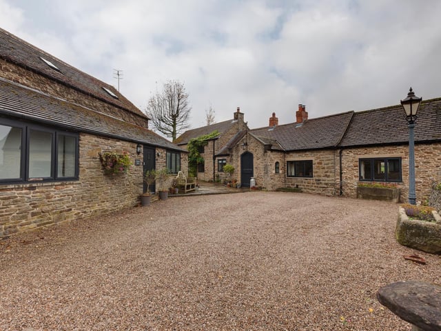 The approach to stone-built Sycamore Farm with its extensive accommodation.