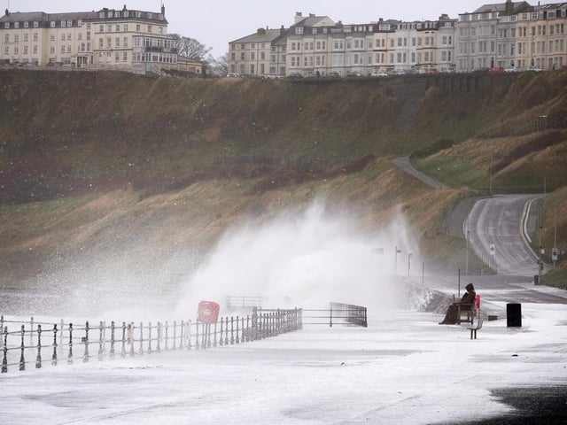 Freddie Gilroy takes a bath as waves and spray are whipped up.
