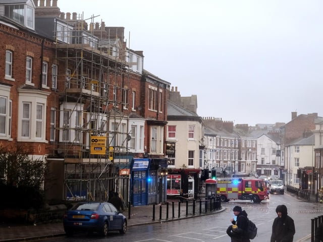 A cordon is put in place on Victoria Road due to falling debris.