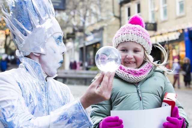 Ellie Dix, six, with The Icicle King and his magic ball at The Woolshops in Halifax as part of Halifax BID's festive activities.