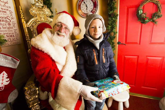 Father Christmas in Halifax's Westgate Arcade with Ryszard Bochenko, nine.
