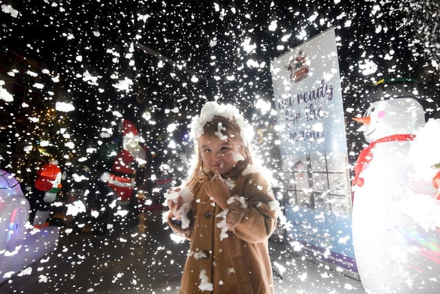 The event, inside the history Grade II listed venue, will run until January 2. Pictured is four-year-old Heidi Singleton-Harvey, enjoying the snow machine and lights show.