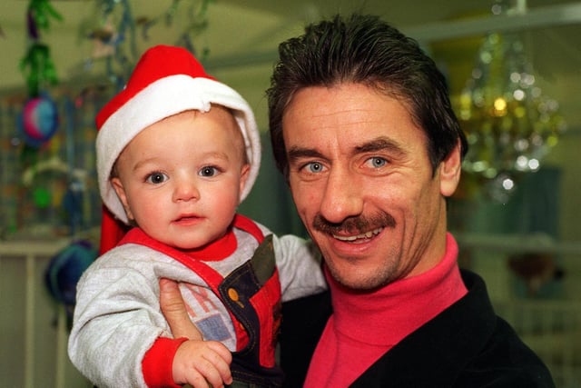 Christmas came early for young patients in the children's ward at Leeds General Infirmary when the Leeds United squad paid them a visit. Pictured is captain Ian Rush pictured with young Kyle Taylor from Bramley.