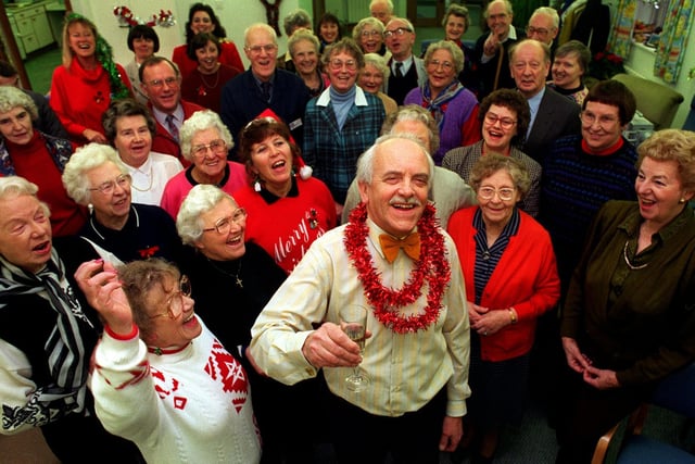 Wheatfields Hospice much loved fund raising organiser Nelson Redman (centre) celebrates his retirement on Christmas Eve 1996 with some of the fundraising volunteers he supervises.