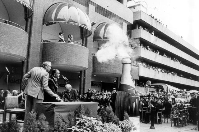 A giant champagne cork popped as Mayor Collin Hanson opened Hounds Hill shopping centre, 1980