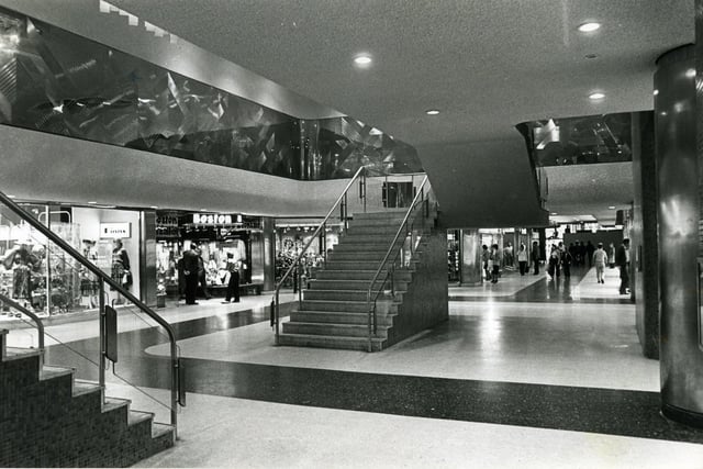 Hounds Hill in 1980 showing the stairs leading to the upper level cafe. Also in the pic is Alan Boyson 's stainless steel frieze and ceiling lights