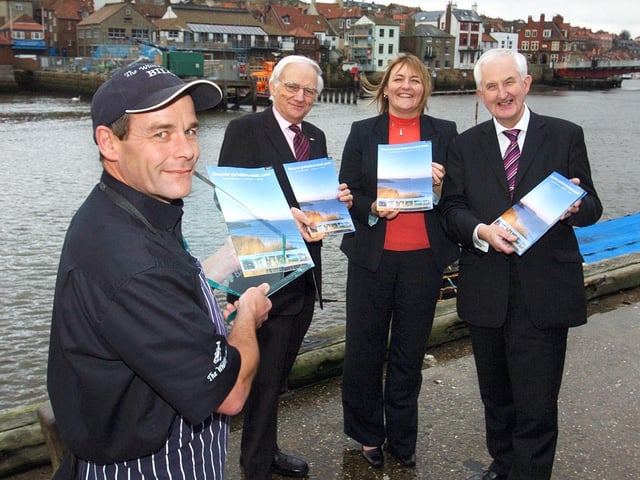 The Whitby Catch’s Bill Rae with his tourism award and the new holiday guide.