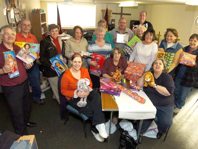 Whitby Salvation Army and Inner Wheel volunteers wrap presents for families in need.