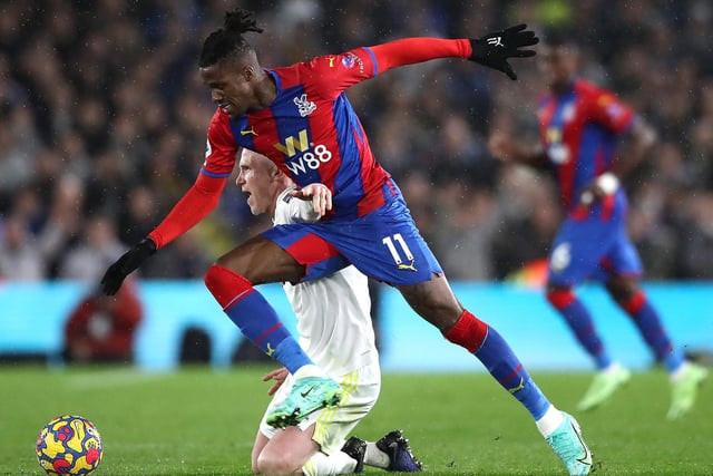 Adam Forshaw challenges Palace forward Wilfred Zaha.