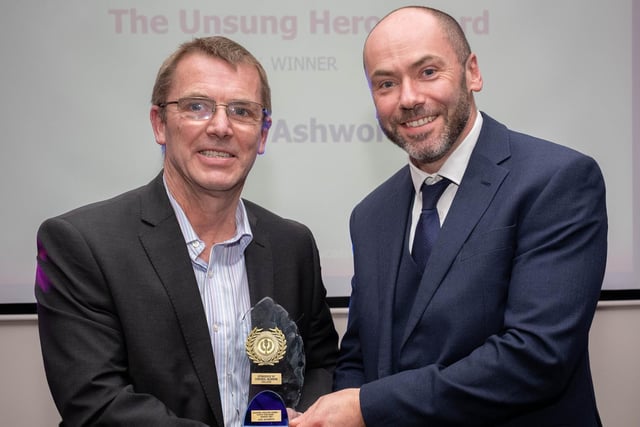Unsung Hero Award winner Dave Ashworth of Baines School (left) receives his award from Cardinal Newman College Assistant Principal Tony Aspinall