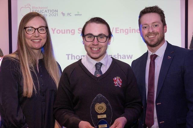 Young Scientist/Engineer of the Year Award winner Thomas Renshaw of St Aidan's C of E School receives his award from Charlotte Thorpe and Dave Connor of Ameon.