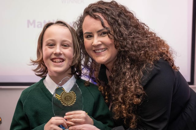 Primary School Pupil of the Year Matthew Barlow of St John Vianney RC Primary receives his award from JPI Media Account Manager Kayleigh Molly.