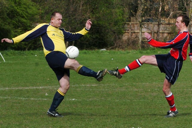 Prostar v Garforth Rangers. Wakefield and District League. Chris Askew, right, of Garforth beats  Martin Orchard of Prostar to the ball.