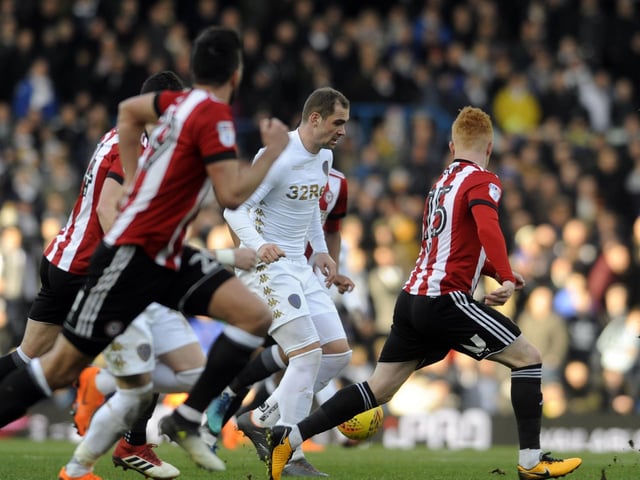 Striker Pierre-Michel Lasogga drives through the Brentford defence.