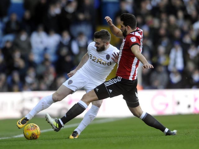 Stuart Dallas is challenged by Brentford's Yoann Barbet.