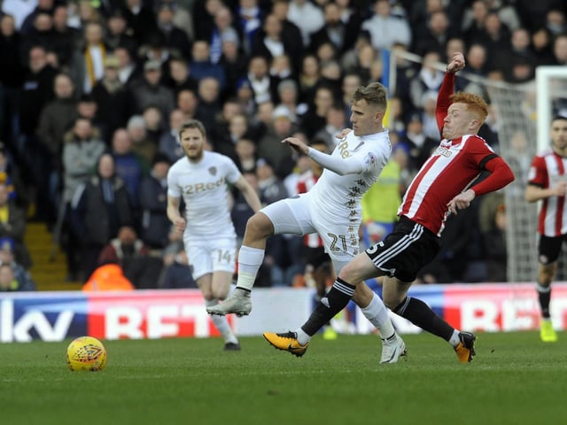 Samuel Saiz is challenged by Brentford's Ryan Woods.