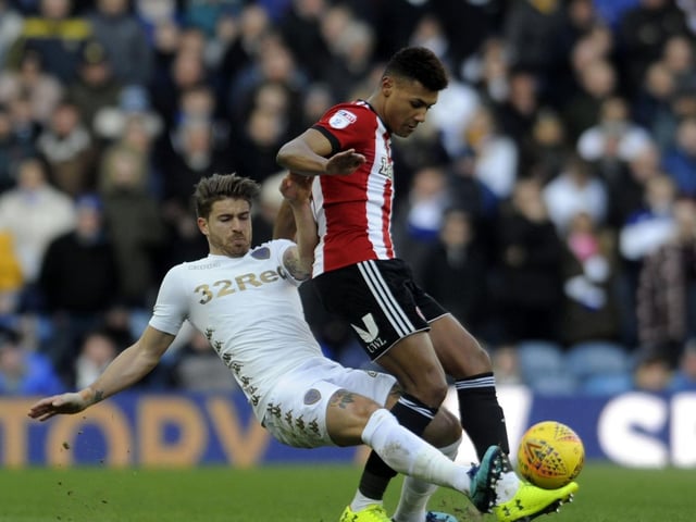 Gaetano Berardi challenges Brentford striker Oli Watkins.