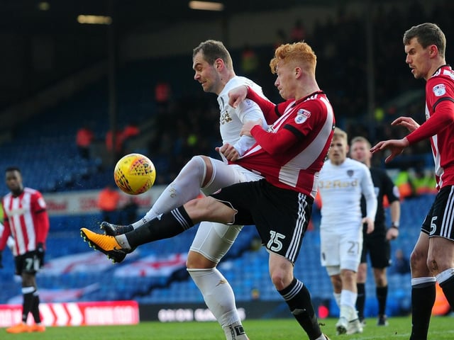 Pierre-Michel Lasogga shields the ball from Brentford's Ryan Woods.
