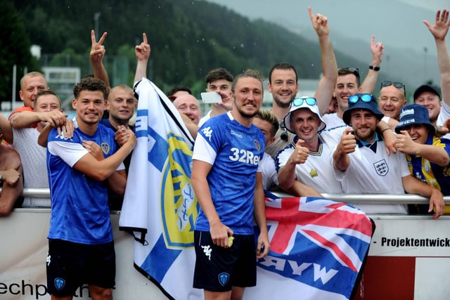 Luke Ayling and Kalvin Phillips pose with fans at a pre-season friendly against Borussia Mönchengladbach in July 2017.