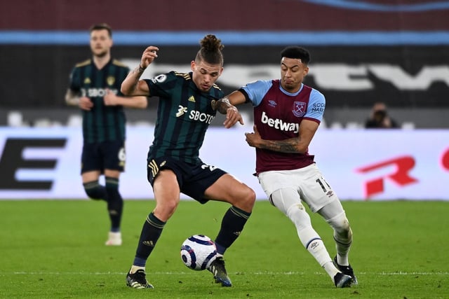 Jesse Lingard challenges Phillips during the Whites' 2-0 defeat to West Ham United at the London Stadium in March 2021.