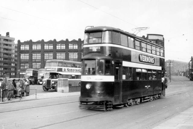 Tram no 529 travelling along York Street on route 15 to Whingate. The bus station can be seen on the left. An advert for Vernons Pool's is visible on the side of tram.