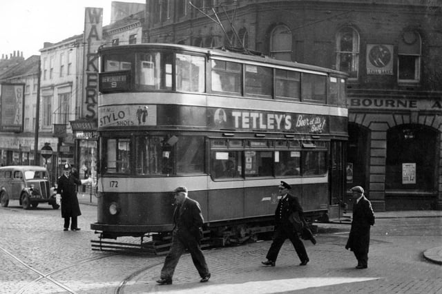 Tram no 172 on Kirkgate at the junction with Call Lane on route no 9 to Dewsbury Road in October 1954. The Scotsman Hotel can be seen on the corner of Call Lane with Walkers drapers at Kirkgate also visible.