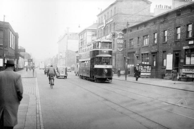 Tram no. 538 travelling along Wellington Street on route no. 18 to Cross Gates in September 1954. James Hare Ltd., woollen merchants and manufacturers can be seen. National bus station is visible on the right.