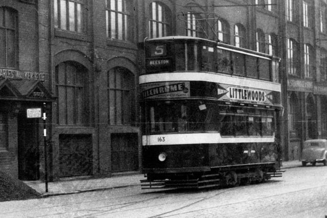 Sovereign Street in October 1954 showing tram number 163 on route number 5 to Beeston. Charles Walker and Co Mill furnishers can be seen on the left.
