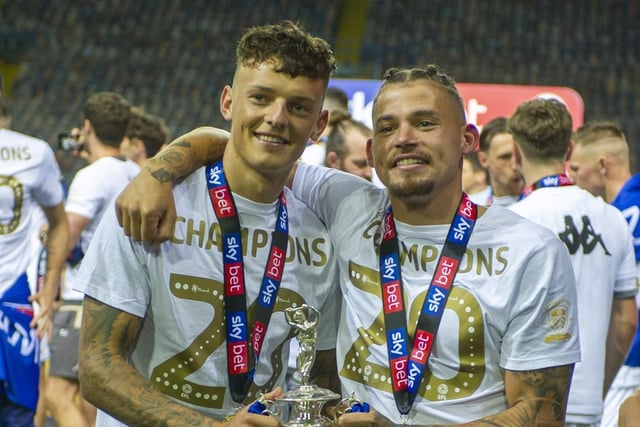 Phillips celebrates Leeds' Championship title with Brighton loanee Ben White in July 2020.