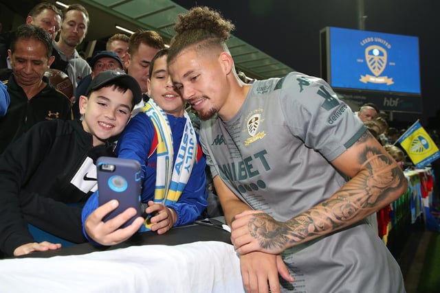 Phillips poses for photos with fans at a training session in Perth, Australia in July 2019.