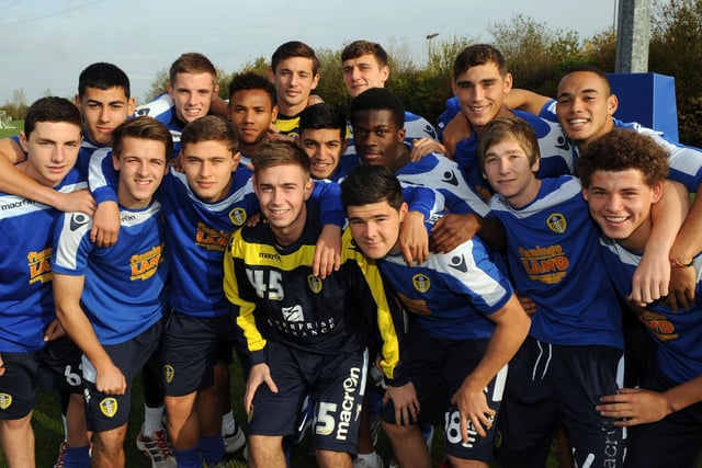 Phillips with Alex Mowatt, Tyler Denton, and Lewie Coyle as the Leeds United Under-18s pose for a photo.