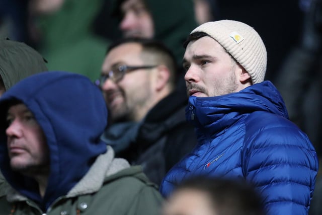 A PNE supporter watches the action intently at Ewood Park