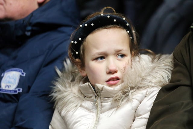 A young PNE fan watches the game at Blackburn