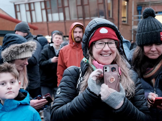 People capture the fun on camera.
215088l