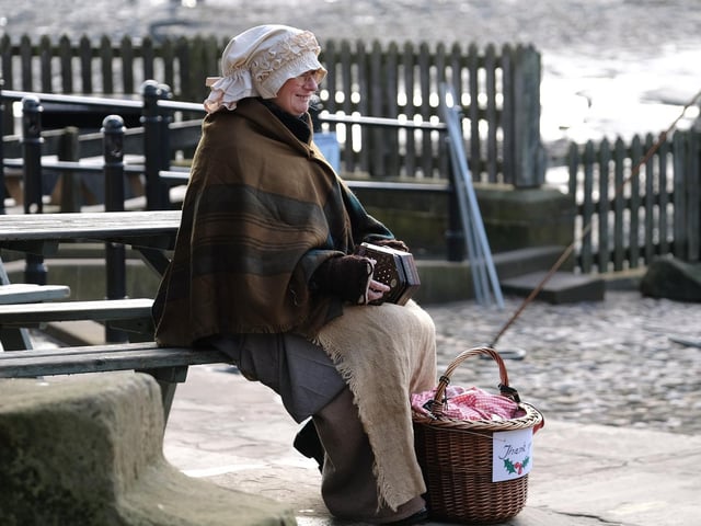 Playing the accordian.
215083g