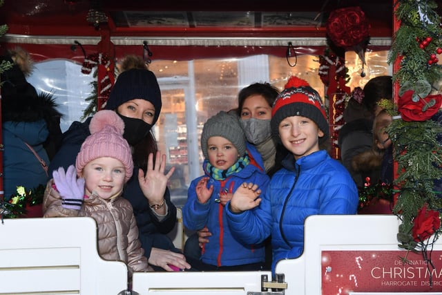 Families enjoy a ride on the Candy Cane Express