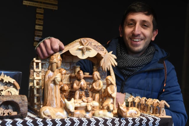 Ash Taman with Christmas Nativity wood carving on the From The Olive Tree Stall