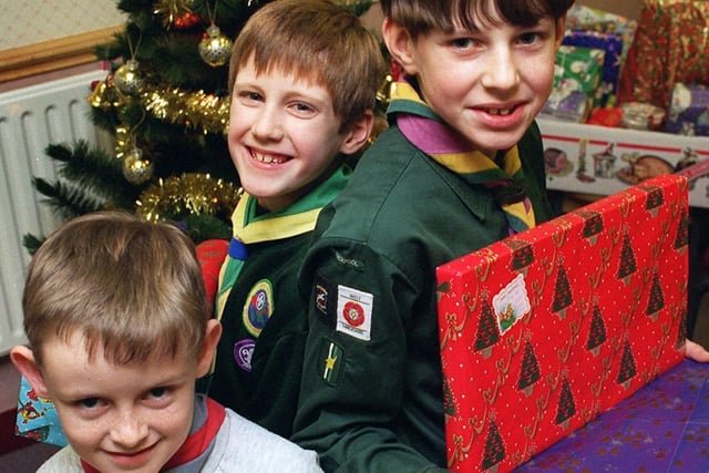 Blackpool district cubs, scouts and beavers collected money and presents for the United for Christmas appeal. L-R Matthew Kilcoyne,Alan Wrigley and Ben Sly, 1996