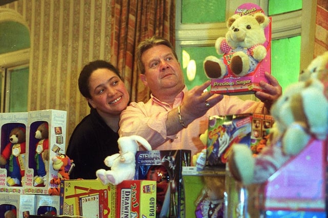 Regulars at the Three Legs pub in Leeds city centre dug deep to provide toys for young patients at hospitals across the city. Pictured are Karaoke presenter 'Big Jackie' and landlord Geoff Rose.
