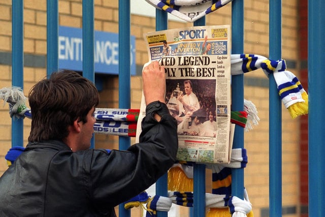 'United legend - Simply the best.' A fan pins the back page of the Yorkshire Evening Post to a gate at Elland Road.
