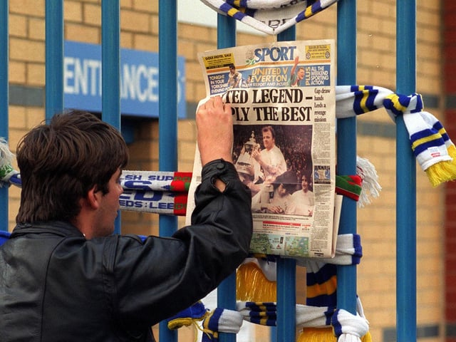 'United legend - Simply the best.' A fan pins the back page of the Yorkshire Evening Post to a gate at Elland Road.
