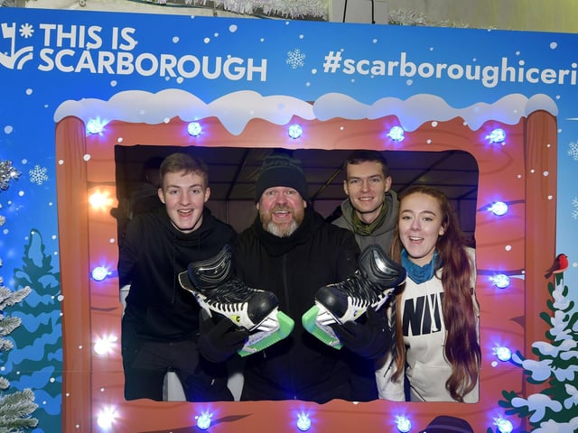 Ready to skate ... Sam, John and Dan Anderson with Libby Mills.