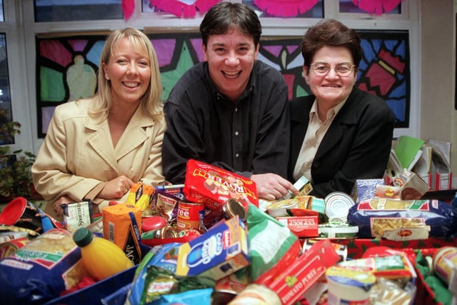 St Anne's Shelter in Leeds was given food hampers by Privilege Insurance. Pictured are Carolyn Alexander (right) representing the shelter, accepting the parcels from Dave Avison and Julie Reynolds