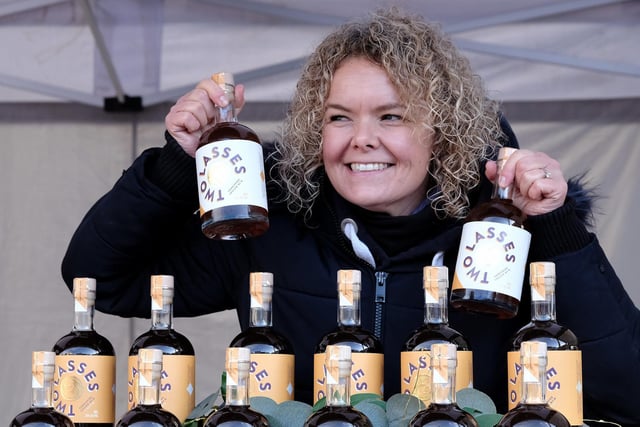 Rebecca Allinson of Two Lasses Spirits selling her produce at the market.