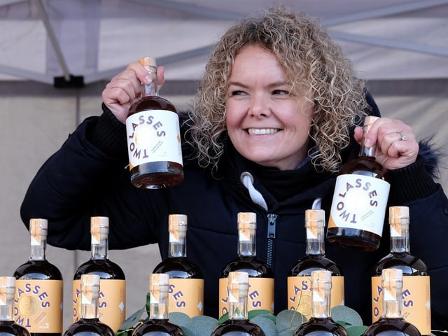 Rebecca Allinson of Two Lasses Spirits selling her produce at the market.