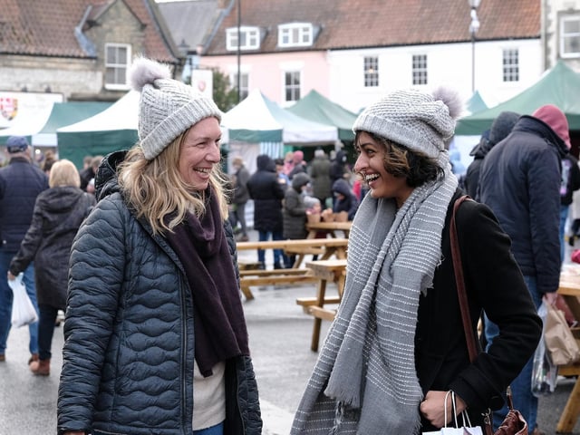 Friends having a great time at the market.