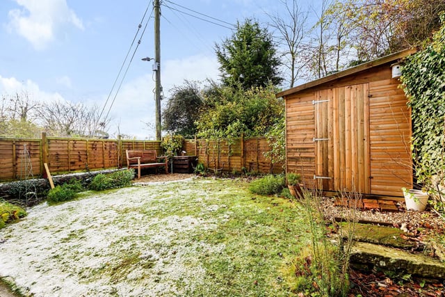 The garden and its shed with a sprinkling of snow